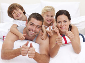 Family Putting Thumbs Up