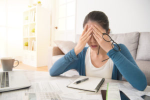 Woman Puts Hands Over Eyes Out Of Frustration