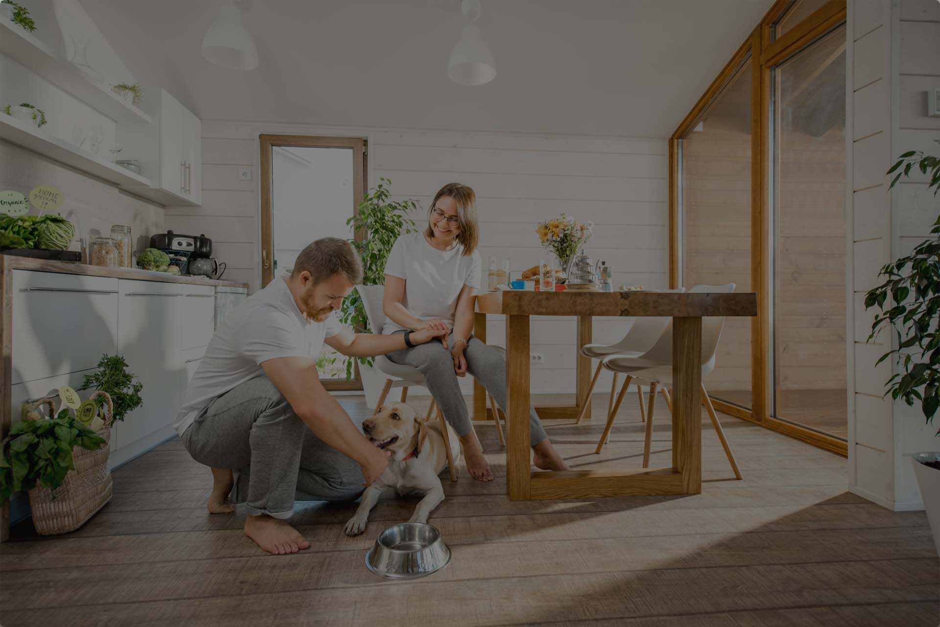 Family In Kitchen With Pet Dog